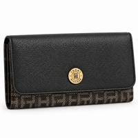 Billetera Tommy Hilfiger negra con monograma y emblema dorado